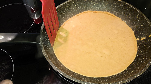 {image: Cooking the crepe}