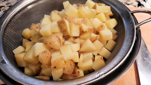 {image: strain the potatoes}